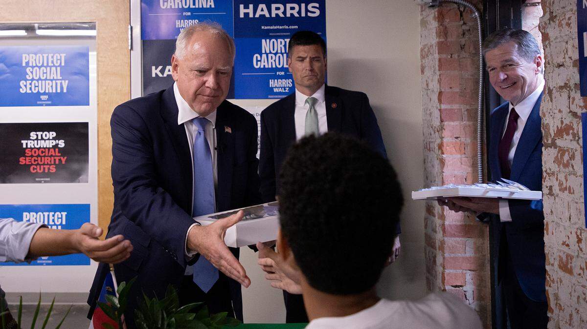 Democratic vice presidential candidate Tim Walz delivers cookies to the Harris-Walz campaign headquarters in Raleigh, N.C., Thursday, August 29, 2024.
