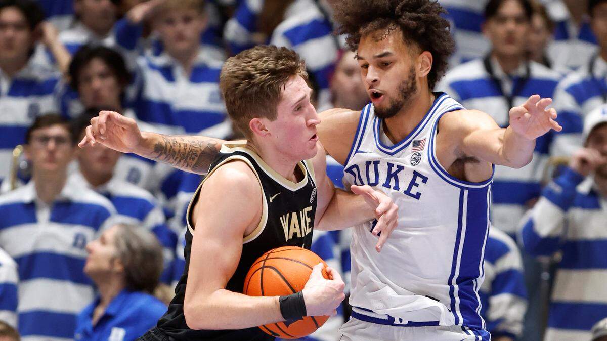 Duke’s Dereck Lively II (1) defends Wake Forest’s Andrew Carr (11) during the second half of Duke’s 75-73 victory over Wake Forest at Cameron Indoor Stadium in Durham, N.C., Tuesday, Jan. 31, 2023.