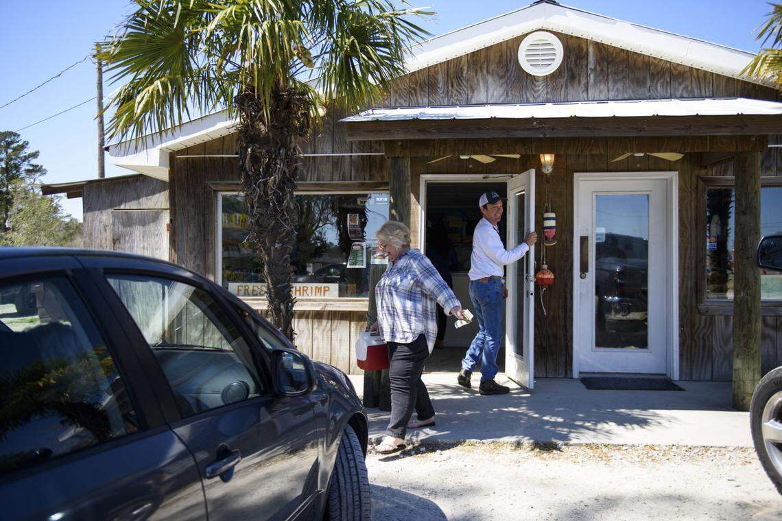 Susan Bowling, who drives in from Bolivia, NC, returns to her car after buying fresh seafood from Coastal Seafood and Propane in Leland, North Carolina on March 23, 2019. “I come here every couple of weeks regularly”, she said of the seafood staple in Leland. The store has been open for 40 years and was closed for a short time after Hurricane Florence with minimal damage. It took several weeks before the store was up to full orders.