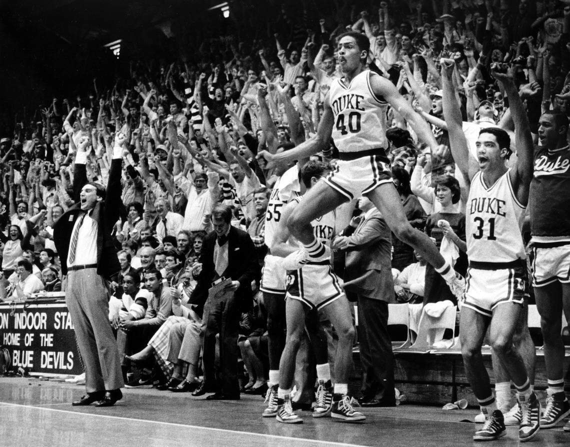 The Duke bench erupts in celebration as Duke clinches a victory over UNC in Cameron Indoor Stadium March 3, 1986.