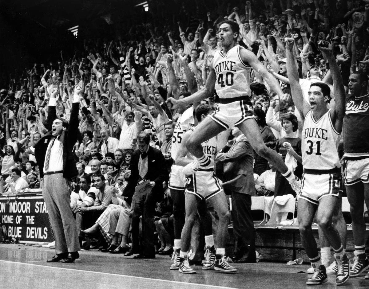 The Duke bench erupts in celebration as Duke clinches a victory over UNC in Cameron Indoor Stadium March 3, 1986.