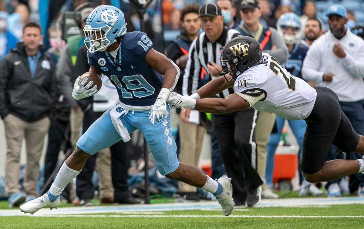 North Carolina running back Ty Chandler (19) rushes 13-yards for a touchdown, his third of of the game in the fourth quarter against Wake Forest on Saturday, November 6, 2021 at Kenan Stadium in Chapel Hill, N.C.