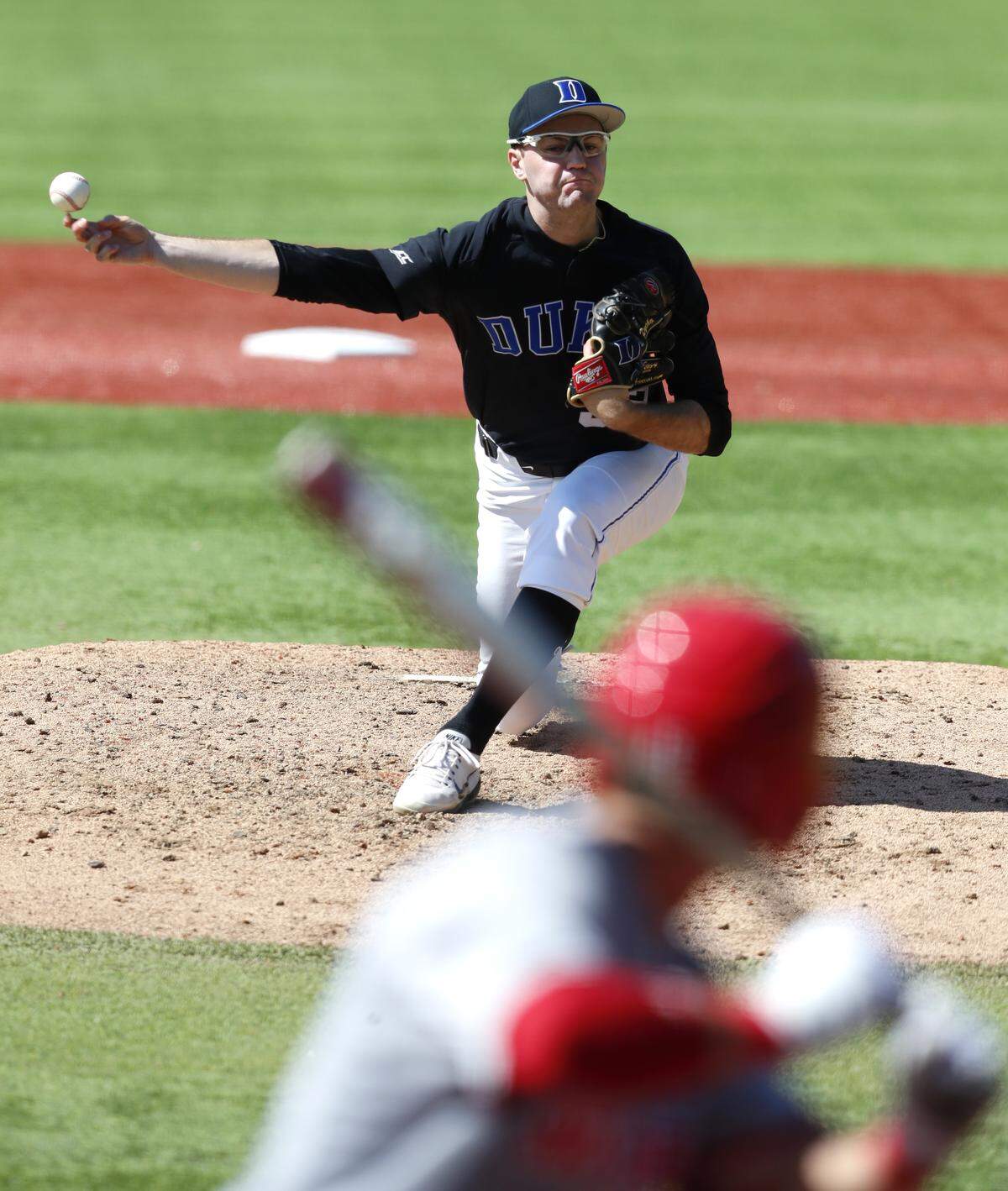 Duke pitcher Ethan DeCaster (32) throws during the Blue Devils' game against N.C. State at Jack Coombs Field Saturday, April 21, 2018.