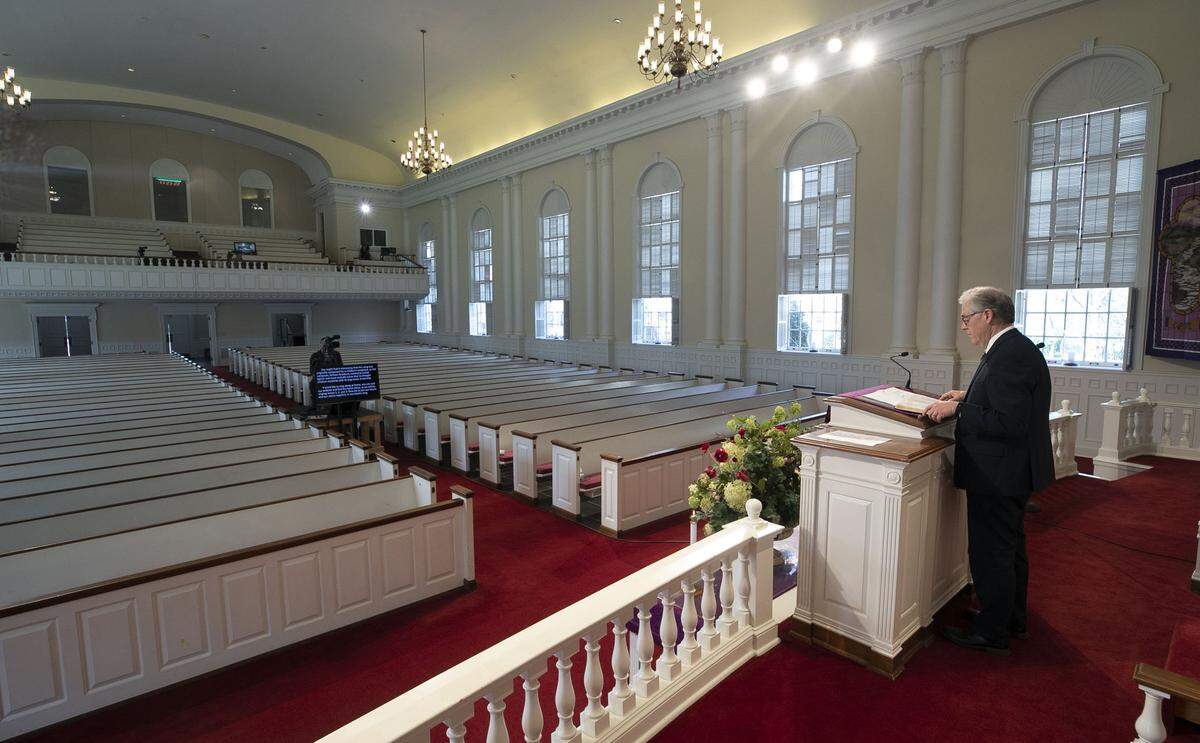 Dr. David Hailey delivers his weekly sermon to an empty sanctuary at Hayes Barton Baptist Church on Sunday, March 22, 2020, in Raleigh, N.C. This is the second week the sanctuary has been closed to the public due to the spread of the COVID-19 virus.