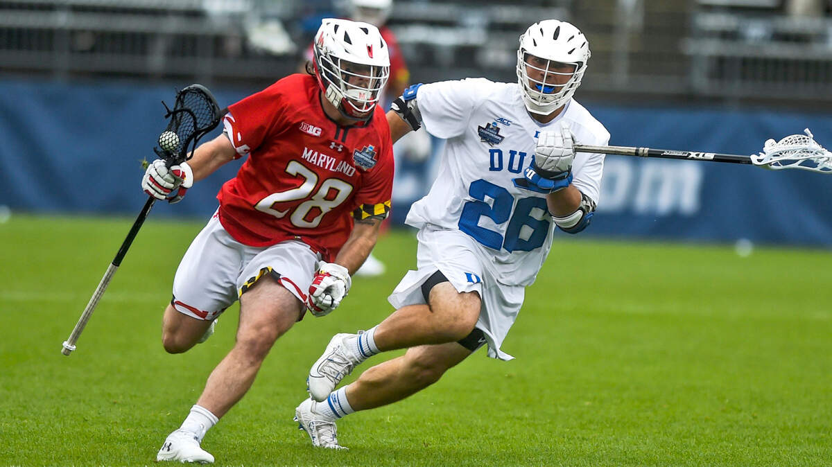Maryland’s Joshua Coffman (28) is guarded by Duke’s Brian Smyth (26) in the semifinals of men’s NCAA Division I college lacrosse tournament at Pratt & Whitney Stadium at Rentschler Field Saturday, May 29, 2021, in East Hartford, Conn.