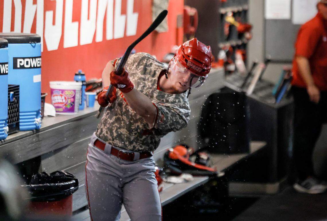 N.C. State’s Noah Soles (2) celebrates with a hockey stick and helmet after hitting a home run in the ninth inning in N.C. State’s 5-3 victory over James Madison in the NCAA Raleigh Regional final at Doak Field Sunday, June 2, 2024.