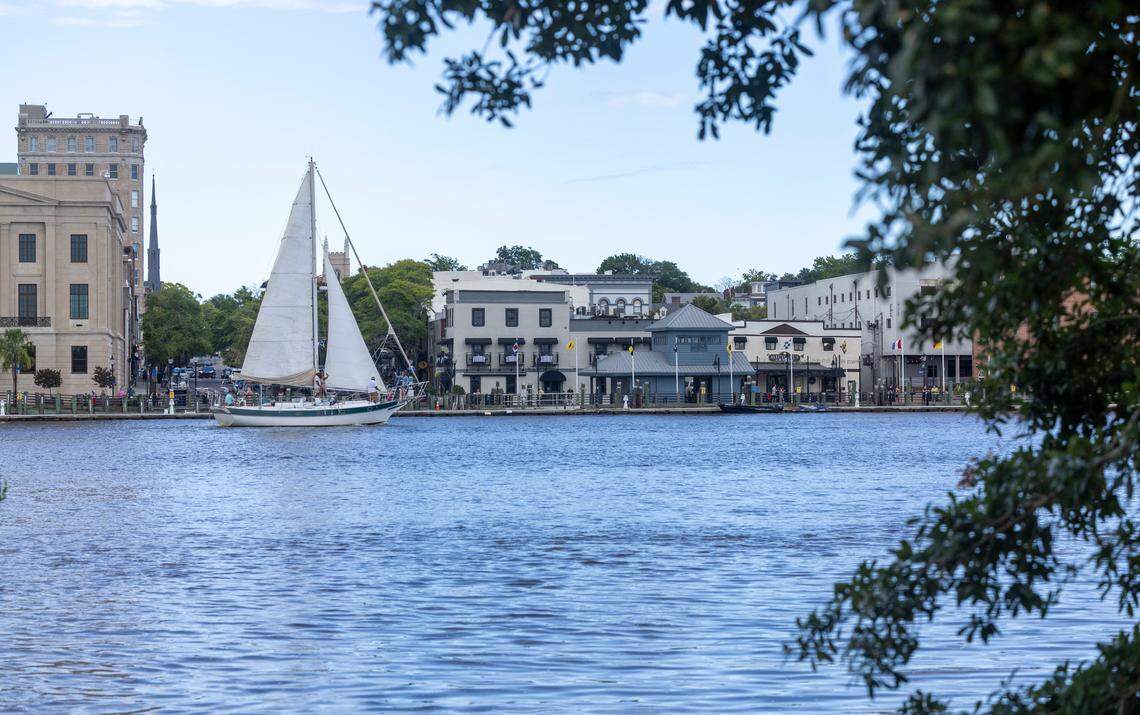 A sailboat on the Cape Fear River passes downtown Wilmington, N.C. where Market Street intersects with the river on Saturday, June 30, 2024.