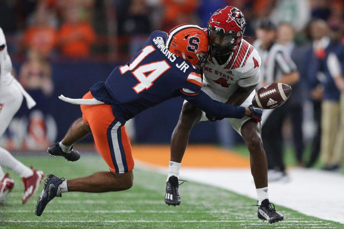 Syracuse defensive back Jason Simmons Jr. (14) breaks up a pass intended for North Carolina State wide receiver Porter Rooks (4) during the first half of an NCAA college football game Saturday, Oct. 15, 2022, in Syracuse, N.Y.