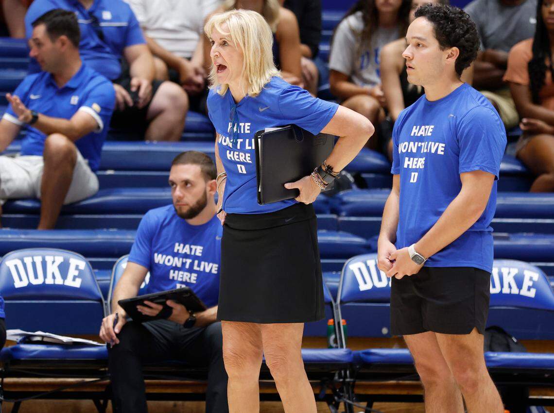 Duke volleyball head coach Jolene Nagel, center, yells instructions to her team during the Blue Devils’ game against East Tennessee State University in the Duke Invitational at Cameron Indoor Stadium in Durham, N.C., Friday, Sept. 2, 2022. Assistant coach Jeremy Garcia stands at right.