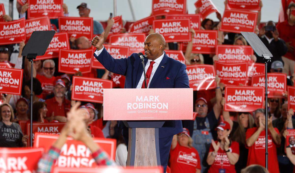 Lt. Gov. Mark Robinson acknowledges the crowd at a rally where Robinson formally launched his gubernatorial campaign Saturday, April 22, 2023, outside the Ace Speedway in Altamahaw, N.C.