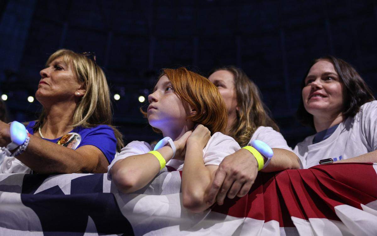 Supporters young and old cheer for Vice President Kamala Harris as she speaks during a rally at the Bojangles Coliseum in Charlotte, NC on Thursday, September 12, 2024.
