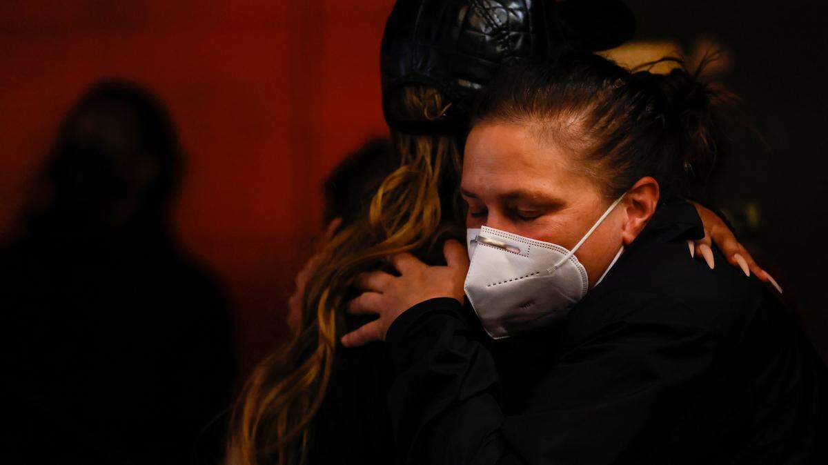 Jil Christensen hugs Naomi Dix following a press conference held on Thursday, Dec. 8, 2022, at the Pinhook in Durham, N.C., regarding the Dec. 3 drag show in Southern Pines, N.C. and the power outage in Moore County.