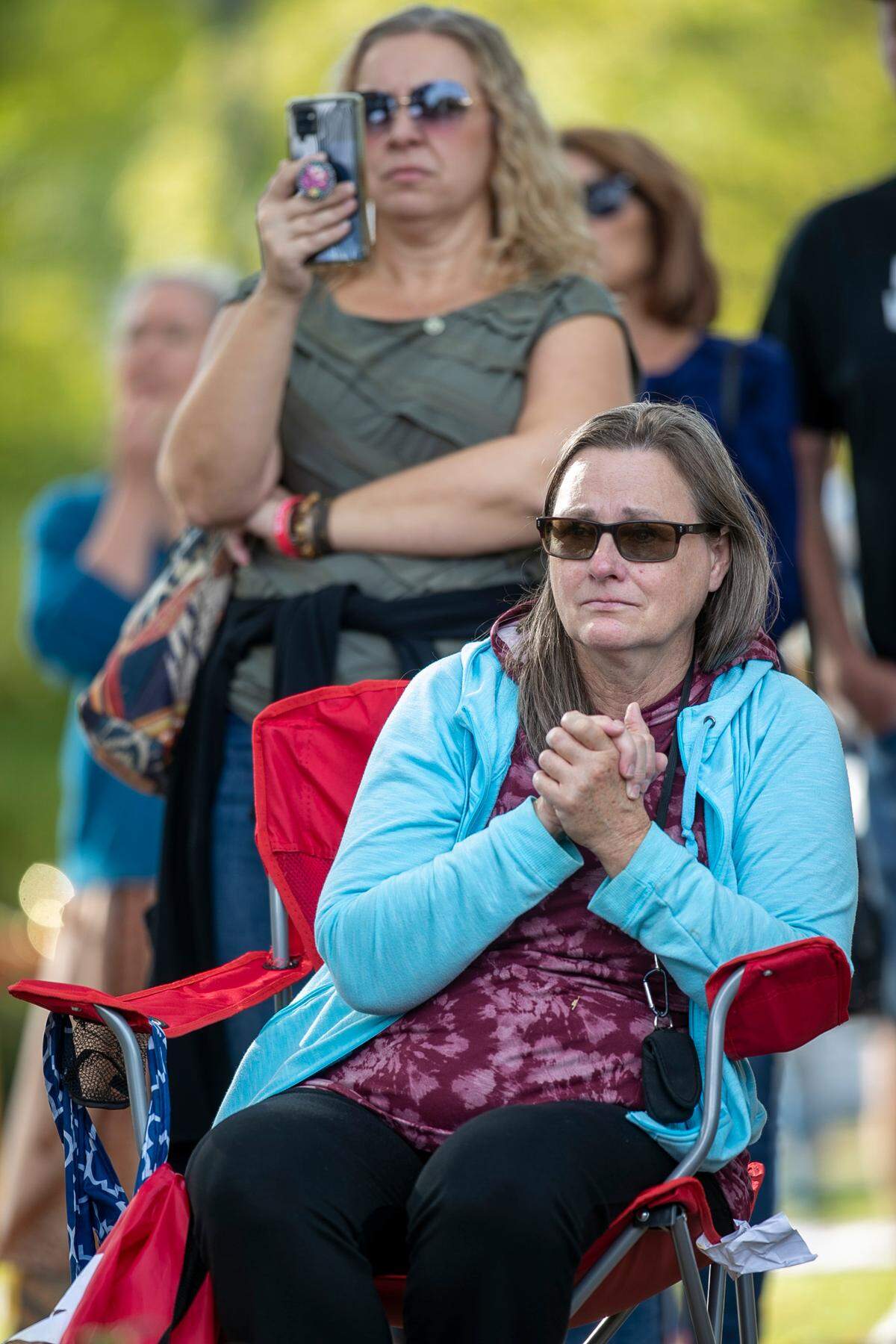 Hedingham residents listen to remarks by Raleigh Mayor Mary-Ann Baldwin during a vigil for the Hedingham mass shooting victims on Sunday, October 23, 2022 on Lichtin Plaza at Raleigh Memorial Auditorium in Raleigh, N.C.