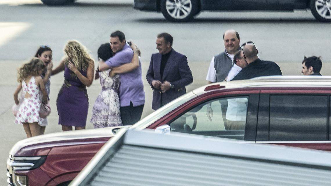 Former N.C. State basketball coach Will Wade is greeted by family and Louisiana State University staff and officials on the general aviation terminal tarmac at Raleigh-Durham International Airport in Morrisville on Thursda. Wade confirmed at about 1 p.m. Thursday that he has resigned at N.C. State to take the head coaching job at LSU.