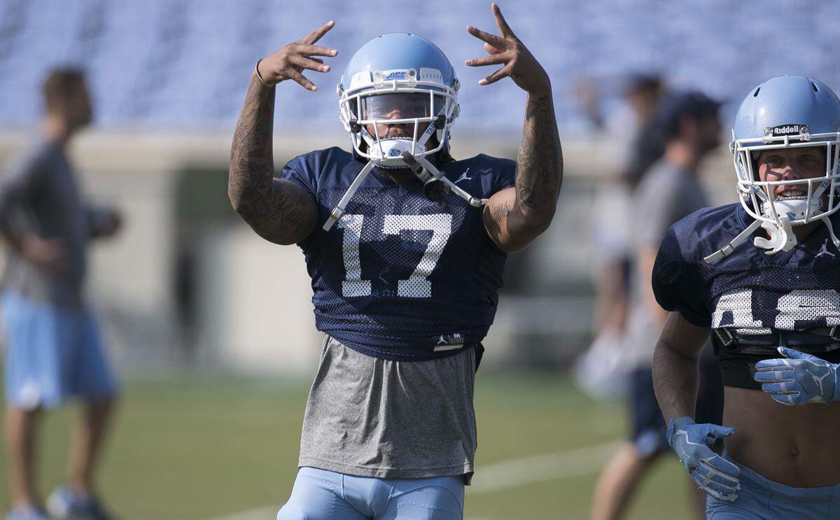 North Carolina receiver Anthony-Ratliff-Williams (17) has emerged as a team leader in his senior season. He motivates his teammates during the Tar Heels’ football camp on Aug. 14, 2018, at Kenan Stadium in Chapel Hill.