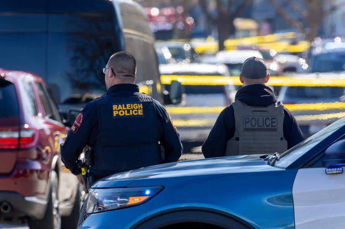 Layers of crime scene tape in the parking lot of N. Hills, as Raleigh Police investigate a possible shooting on Friday, January 17, 2025 in Raleigh, N.C.