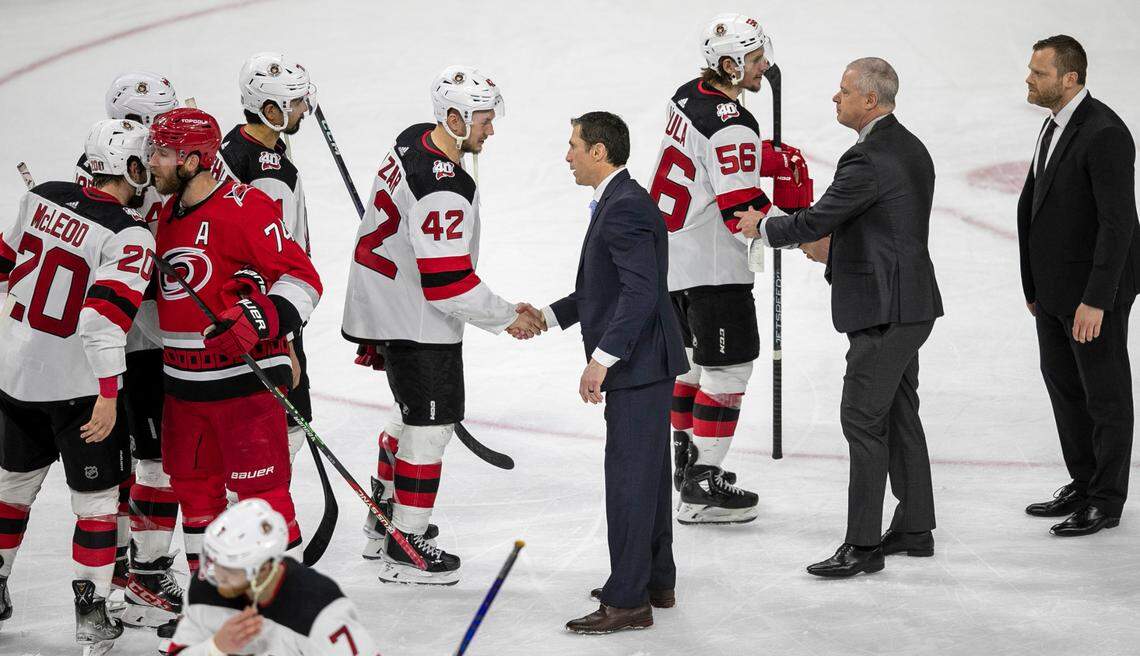 The New Jersey Devils Curtis Lazar (42) congratulates Carolina Hurricanes coach Rod Brind’Amour in the handshake line, following the Hurricanes’ 3-2 overtime victory in Game 5 of their second round Stanley Cup playoff series on Thursday, May 11, 2023 at PNC Arena in Raleigh, N.C.