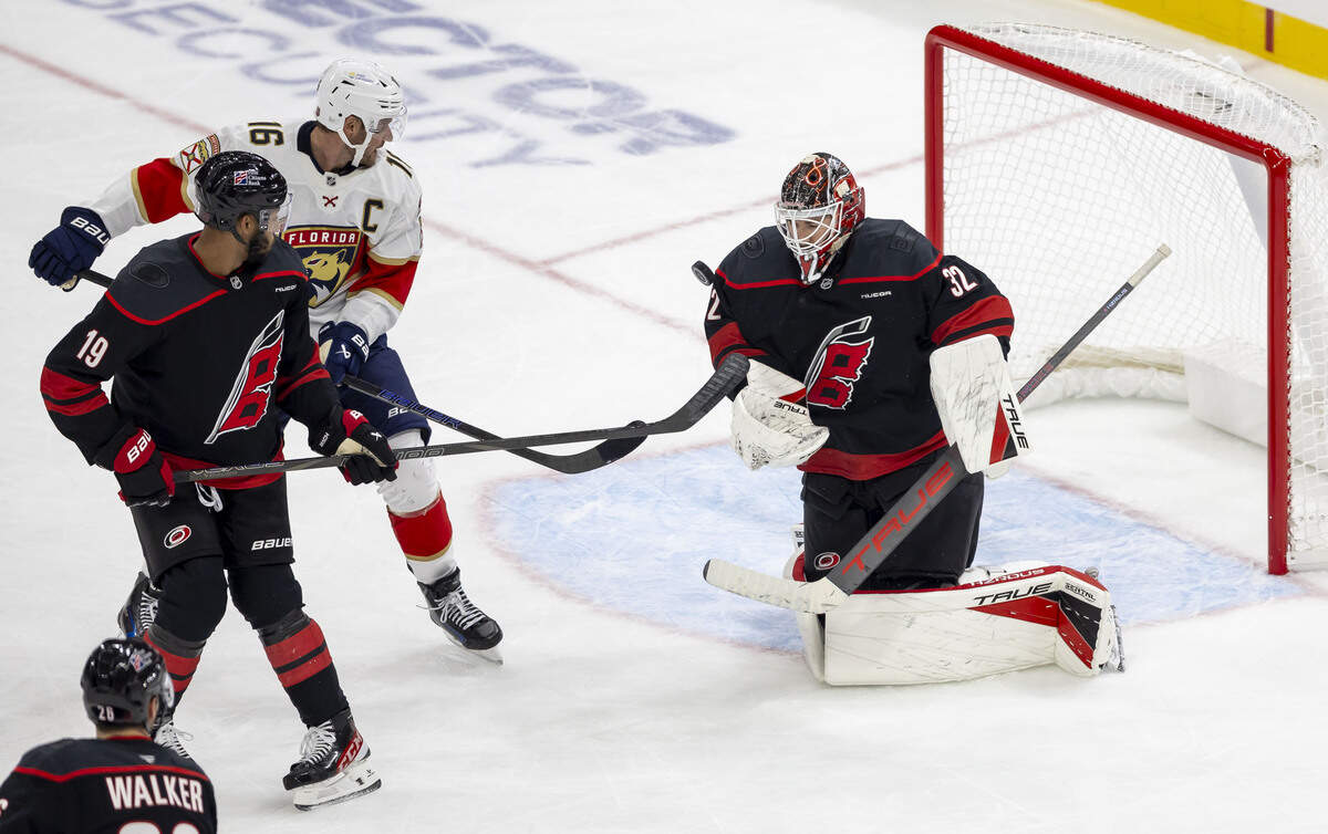 Carolina Hurricanes goalie Brandon Bussi (32) stops a scoring attempt by Florida Panthers center Alexander Barkov (16) in the second period on Tuesday, Sept. 29, 2026, at Lenovo Center in Raleigh, N.C.