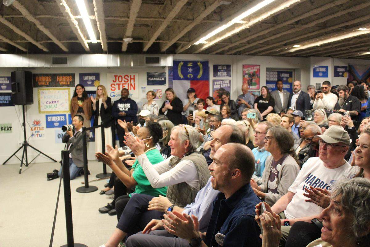 Canvassers for the Kamala Harris presidential campaign listen to First Lady Jill Biden speak in Durham, North Carolina, on Nov. 4, 2024.