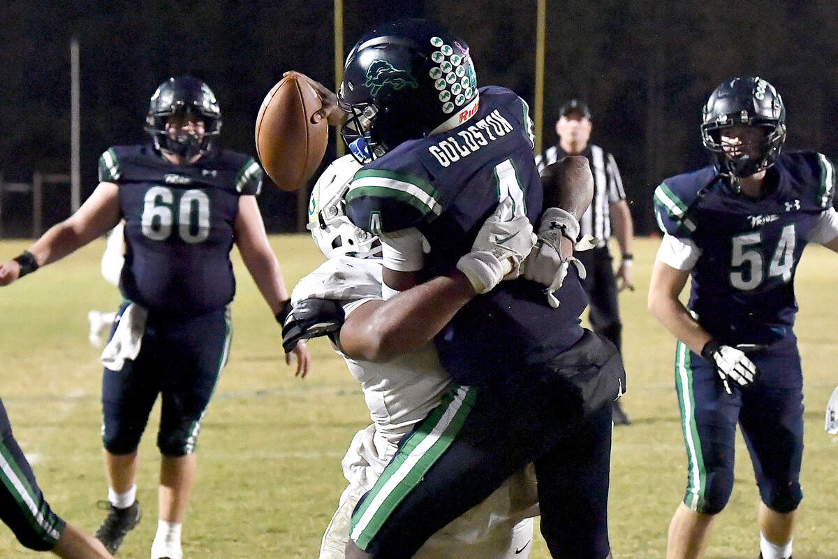 Cardinal Gibbons defensive tackle Chris Pinder (56) rushes Leesville Road quarterback Deiondre Goldston (4) in the end zone and forces the safety late in the second half. The Leesville Road Pride and the Cardinal Gibbons Crusaders met in a conference football game in Raleigh, N.C. on November 1, 2024.