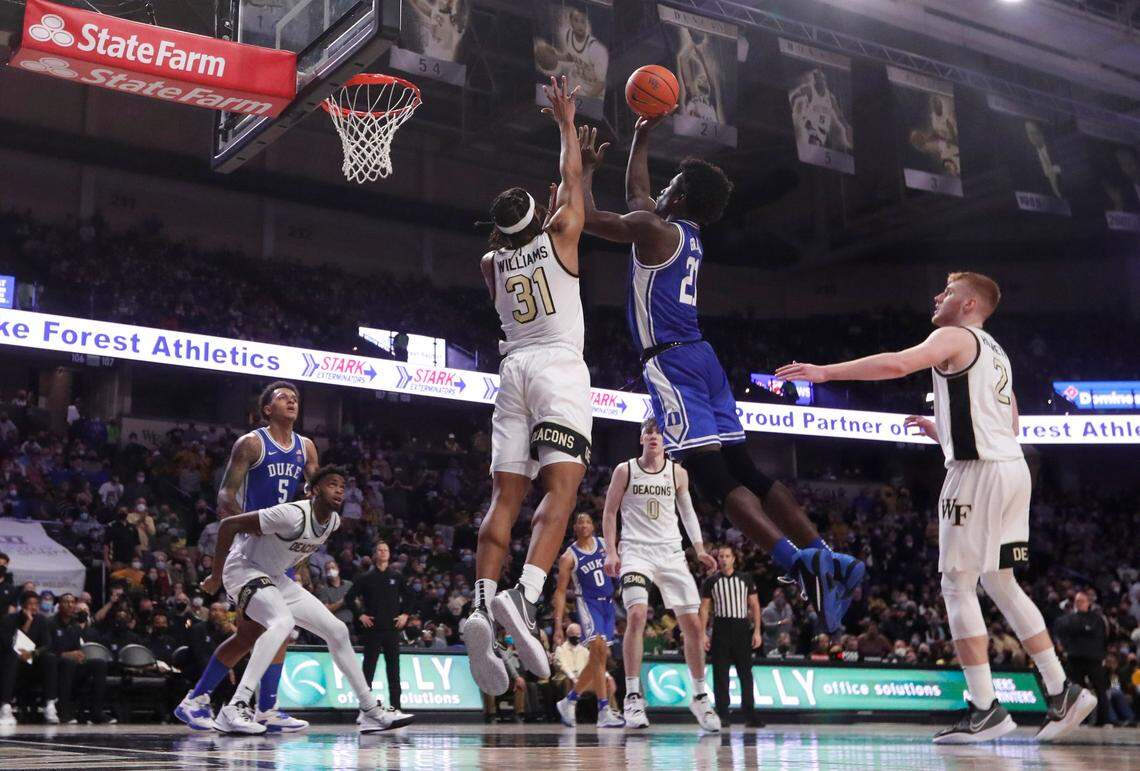 Duke’s A.J. Griffin (21) shoots as Wake Forest’s Alondes Williams (31) defends during Duke’s 76-64 victory over Wake Forest at LJVM Coliseum in Winston-Salem, N.C., Wednesday, January 12, 2022.