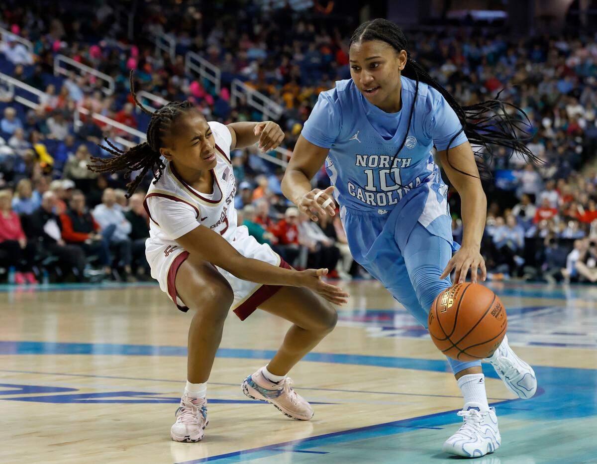 North Carolina’s Reniya Kelly drives past Florida State’s O’Mariah Gordon during the first half of the Tar Heels’ ACC Tournament quarterfinal game on Friday, March 7, 2025, at First Horizon Coliseum in Greensboro, N.C.