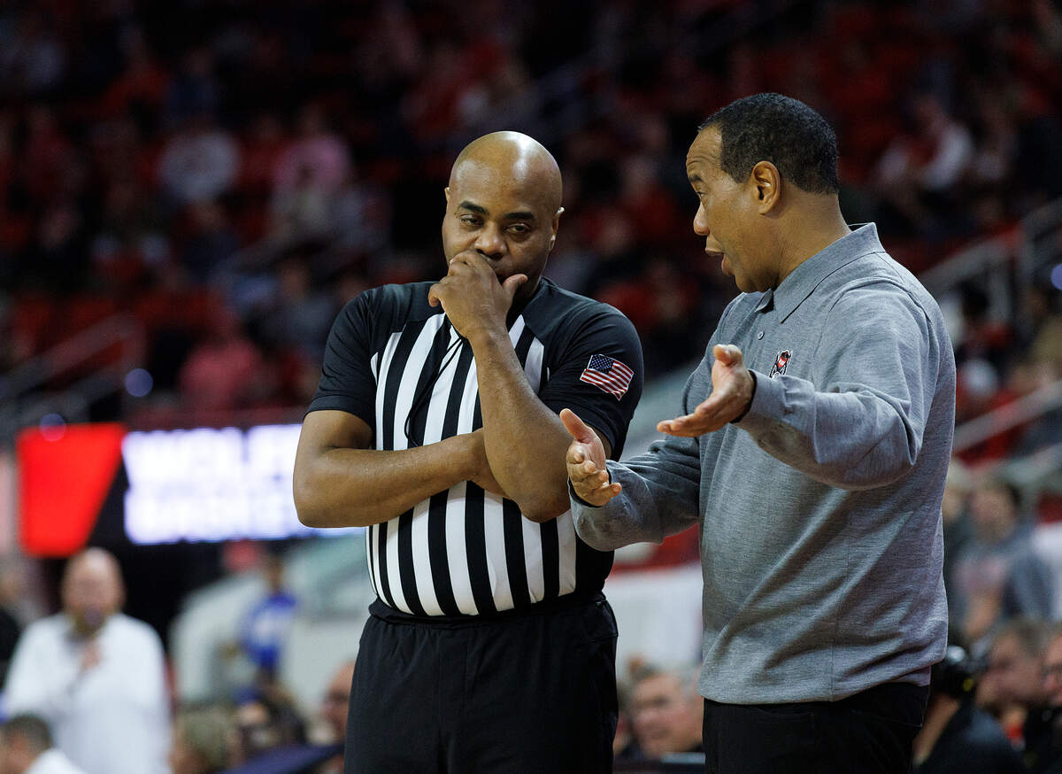 N.C. State head coach Kevin Keatts speaks with an official during the second half of the Wolfpack’s 82-70 win over Saint Louis on Wednesday, Dec. 20, 2023, at PNC Arena in Raleigh, N.C.
