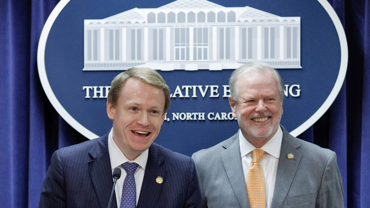 House Speaker Destin Hall and Senate leader Phil Berger smile while taking questions from reporters during a press conference to announce a state budget deal at the Legislative Building on Tuesday, May 12, 2026, in Raleigh, N.C.