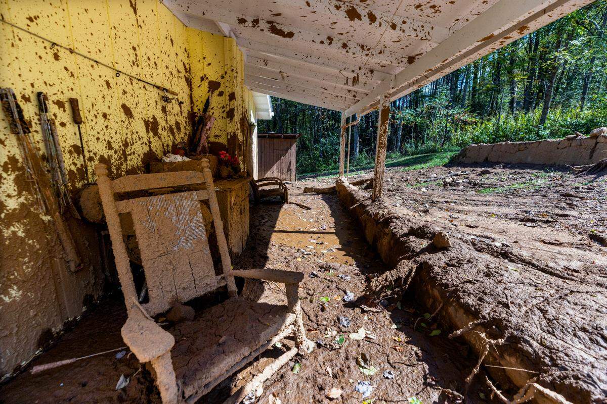 Splattered mud from a landslide sticks to the exterior of a home in Cruso. The remnants of Hurricane Helene caused more than 300 landslides, many in North Carolina.