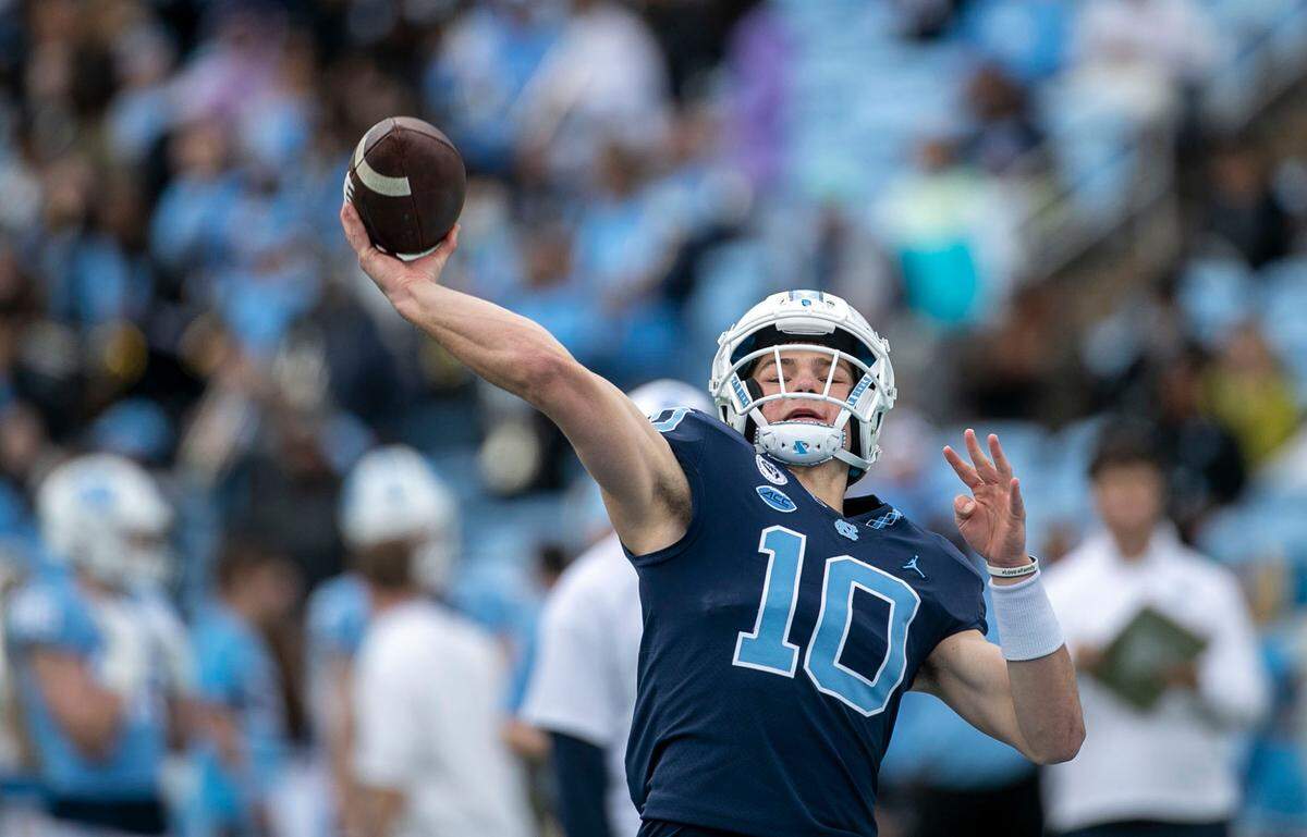North Carolina quarterback Drake Maye (10) releases a long throw during the Tar Heels’ spring football game on Saturday, April 9, 2022 at Kenan Stadium in Chapel Hill, N.C.