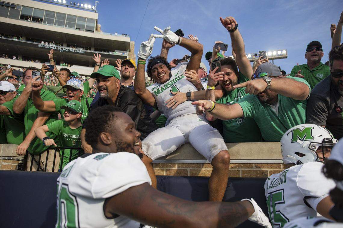 Marshall players and fans celebrate after defeating Notre Dame 26-21 in an NCAA college football game Saturday, Sept. 10, 2022, in South Bend, Ind. Marshall won 26-21.
