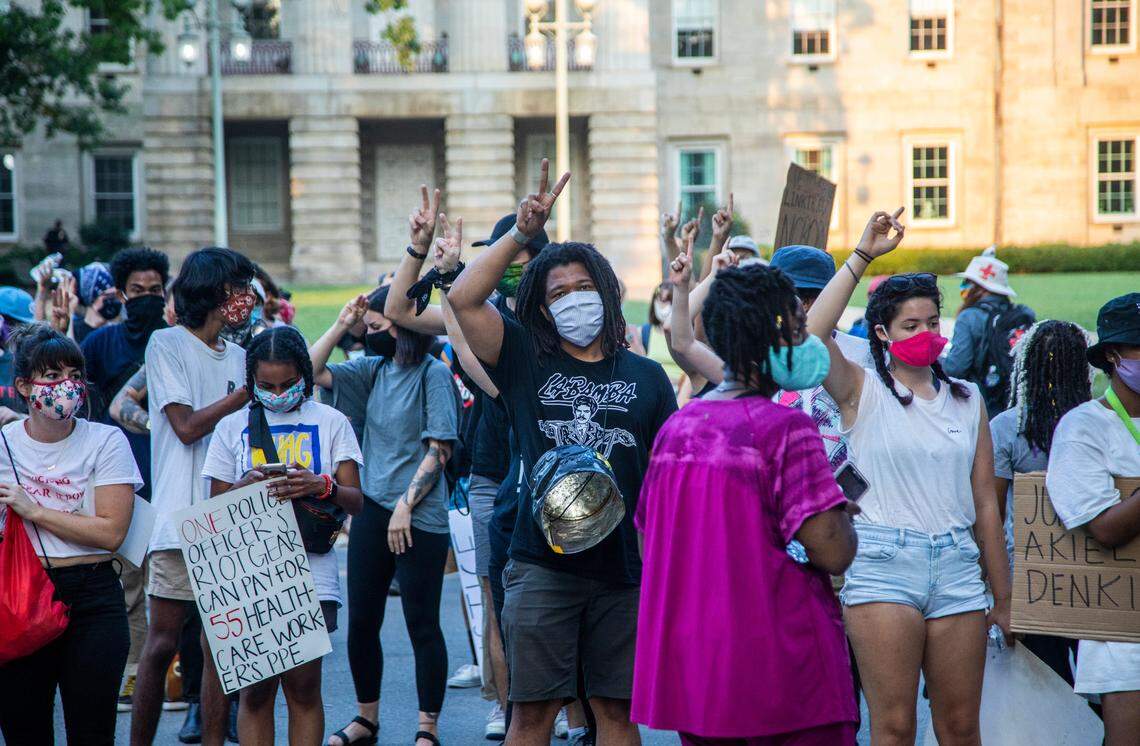 Protesters march after learning the news that N.C. Gov. Roy Cooper vetoed SB 168, which would have restricted death investigation records, while rallying near the former site of the NC Confederate Monument Monday, July 6, 2020.