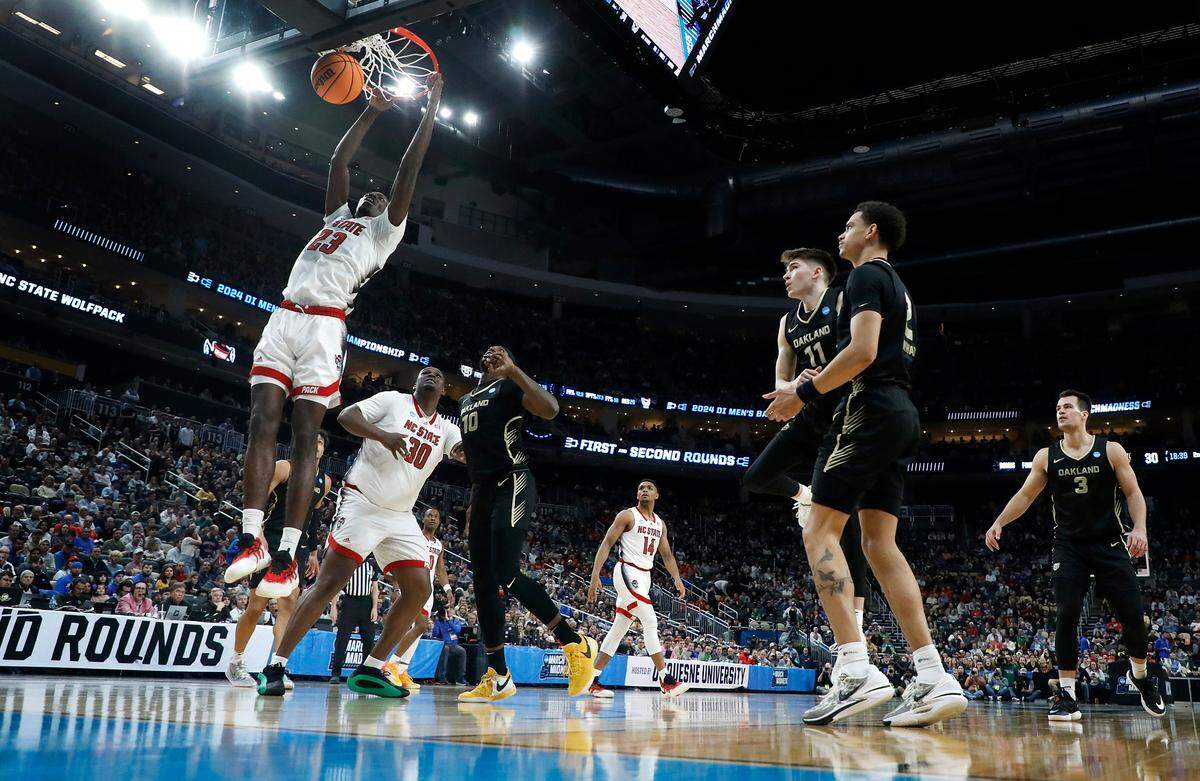 N.C. State’s Mohamed Diarra slams in two during the second half of the Wolfpack’s 79-73 overtime win against Oakland in the second round of the NCAA Tournament on Saturday, March 23, 2024, at PPG Paints Arena in Pittsburgh, Pa.