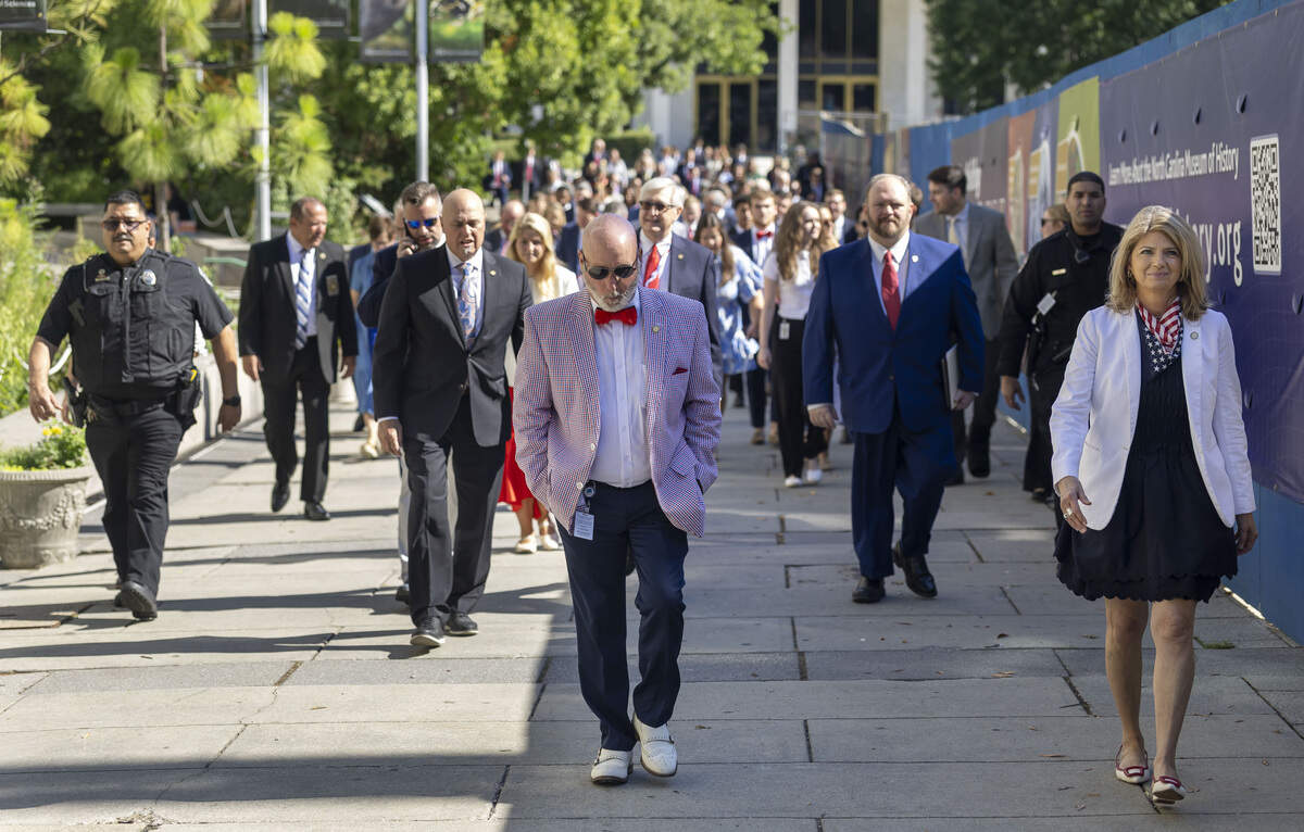 Sens. Bobby Hanig and Lisa Barnes walk with fellow legislators and staff from the Legislative Building to the historic State Capitol for a meeting on Tuesday, June 30, 2026, in Raleigh, N.C.