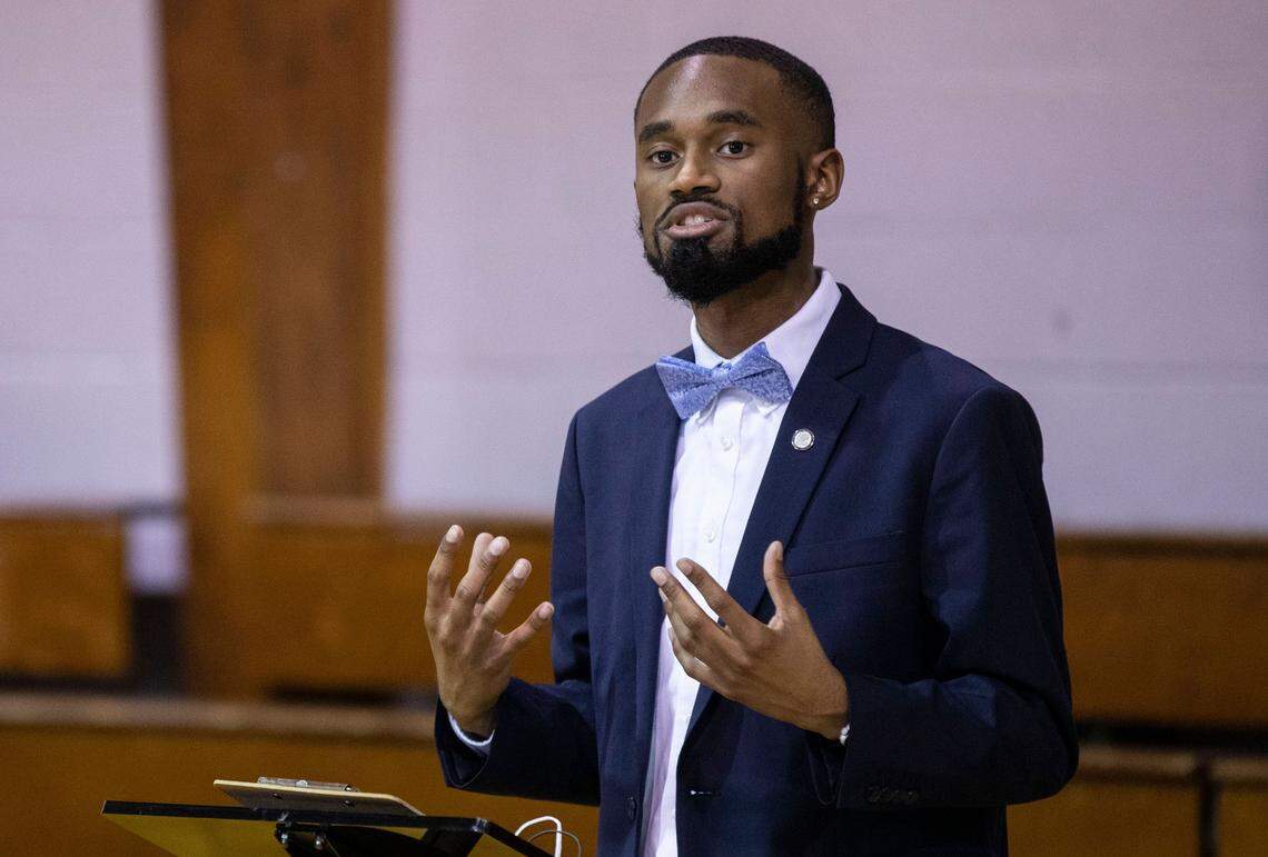 Kinston City Council member Chris Suggs speaks to reporters alongside Governor Roy Cooper at a COVID-19 vaccination and testing event at Holloway Community Center in Kinston, N.C. on Jan. 13, 2022.