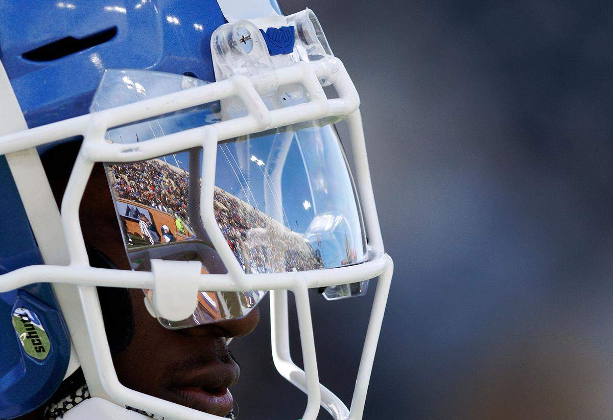 The stands at Allegacy Stadium are reflected in the helmet of Duke’s Sahmir Hagans during the second half of the Blue Devils’ 23-17 win over Wake Forest` on Saturday, Nov. 30, 2024, in Winston-Salem, N.C.