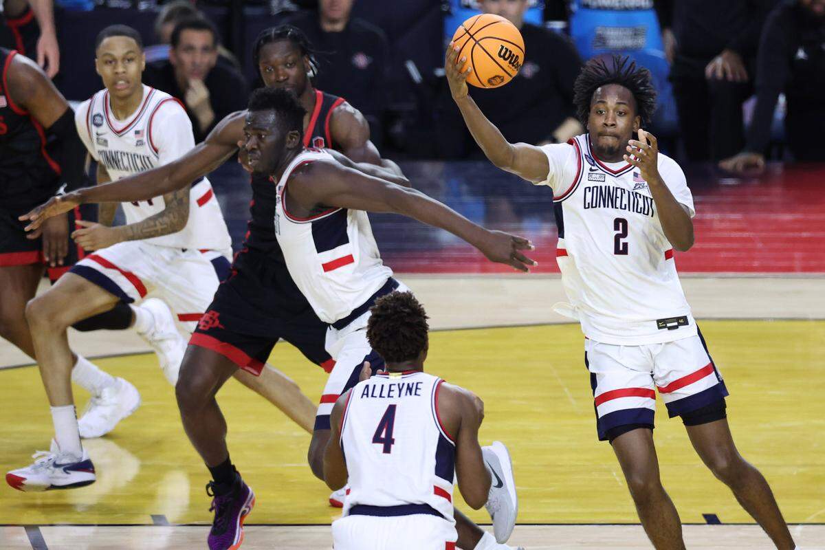 Connecticut Huskies guard Tristen Newton (2) catches a pass against the San Diego State Aztecs during the second half in the national championship game of the 2023 NCAA Tournament at NRG Stadium.