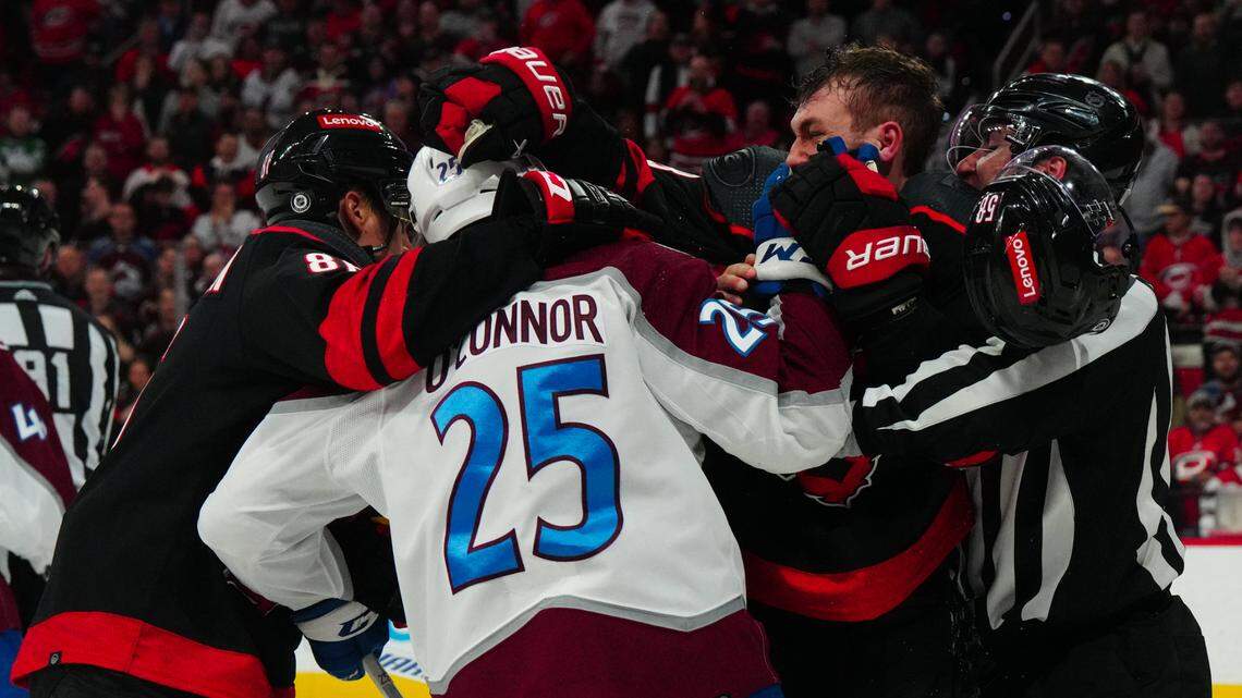 Carolina Hurricanes left wing Michael Bunting (58) and left wing Teuvo Teravainen (86) battle Colorado Avalanche right wing Logan O’Connor (25) during the third period at PNC Arena.