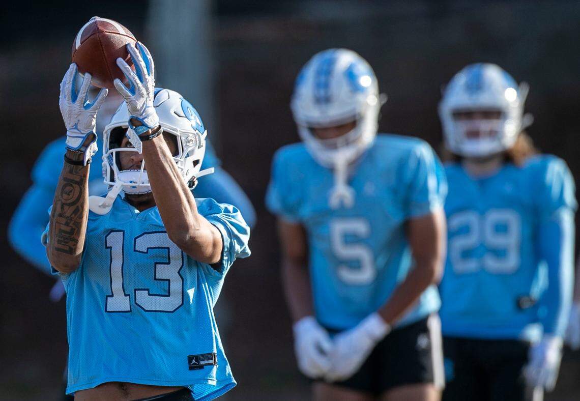North Carolina wide receiver Tylee Craft (13) focuses on a reception during the opening day of the Tar Heels’ spring football practice on Tuesday, March 1, 2022 in Chapel Hill, N.C.