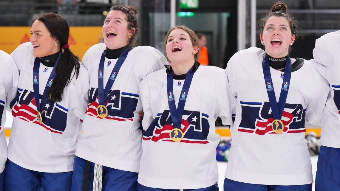 Mary Derrenbacher, second from right, sings the national anthem with USA Hockey teammates, from left, Kendra Distad, Kassidy Carmichael and Alanna Devlin after winning the gold medal over Czechia at the 2024 IIHF U18 Women’s World Championship in Switzerland in January.