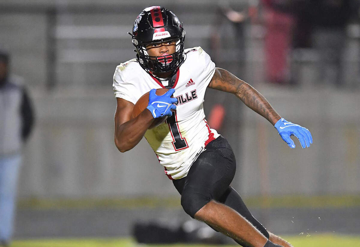 Rolesville’s Tamarcus Cooley (1) runs for yards on the kickoff return during the Rams’ game against Wake Forest in the NCHSAA 4A third round playoff game in Wake Forest on November 18, 2022.
