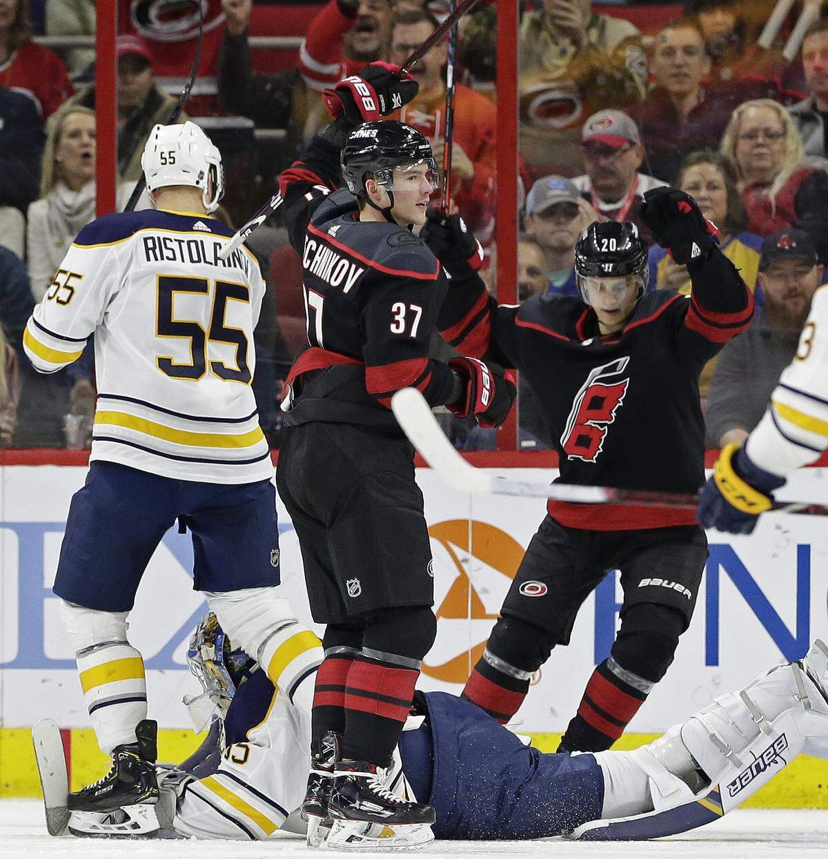 Carolina Hurricanes’ Andrei Svechnikov (37), of Russia, celebrates his goal against Buffalo Sabres goalie Linus Ullmark, of Sweden, as Hurricanes’ Sebastian Aho (20), of Finland, reacts during the second period of an NHL hockey game in Raleigh, N.C., Saturday, March 16, 2019. Sabres’ Rasmus Ristolainen (55), of Finland, looks on. (AP Photo/Gerry Broome)