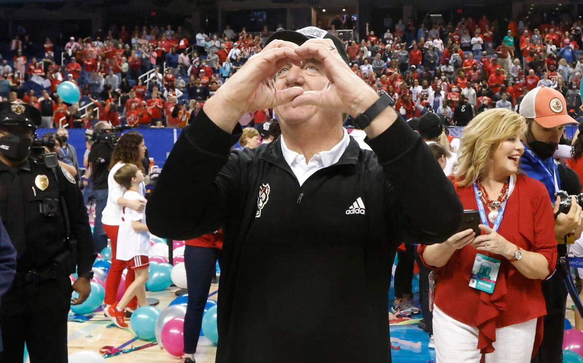 N.C. State head coach Wes Moore shows fans his appreciation after the Wolfpack’s victory over Miami to win the ACC women’s basketball tournament in Greensboro, N.C., Sunday, March 6, 2022.