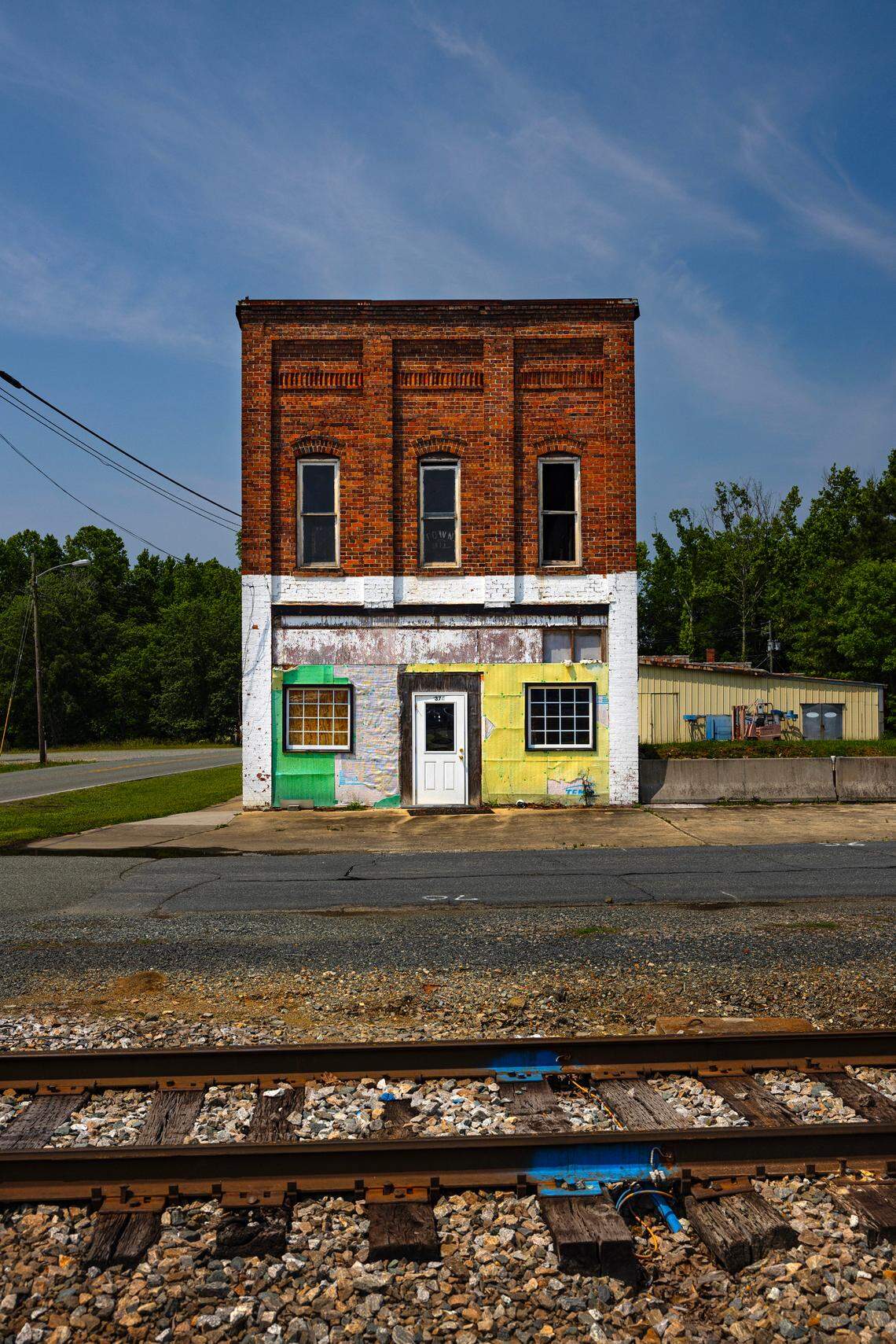 The former town hall building of the small Chatham County town of Goldston stands by the railroad tracks which cut through the center of the town.