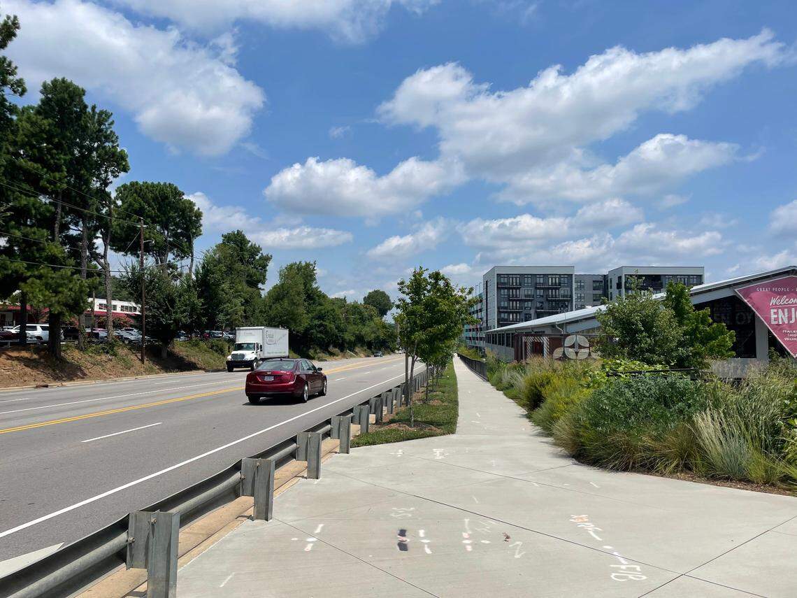 A sidewalk borders the Raleigh Iron Works development along Atlantic Avenue.