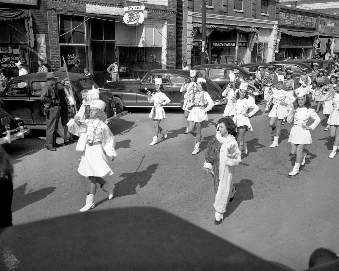 A majorette leads The “Tater Day” parade at Tabor City, NC. October 31, 1947. The areas celebrated its annual sweet potato harvest each year.