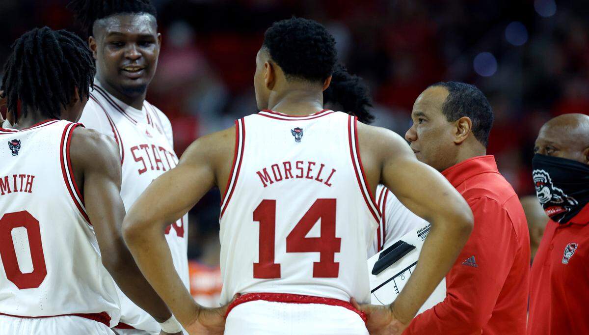 N.C. State head coach Kevin Keatts talks with the team during the second half of Clemson’s 96-71 victory over N.C. State’s game at PNC Arena in Raleigh, N.C., Saturday, Feb. 25, 2023.