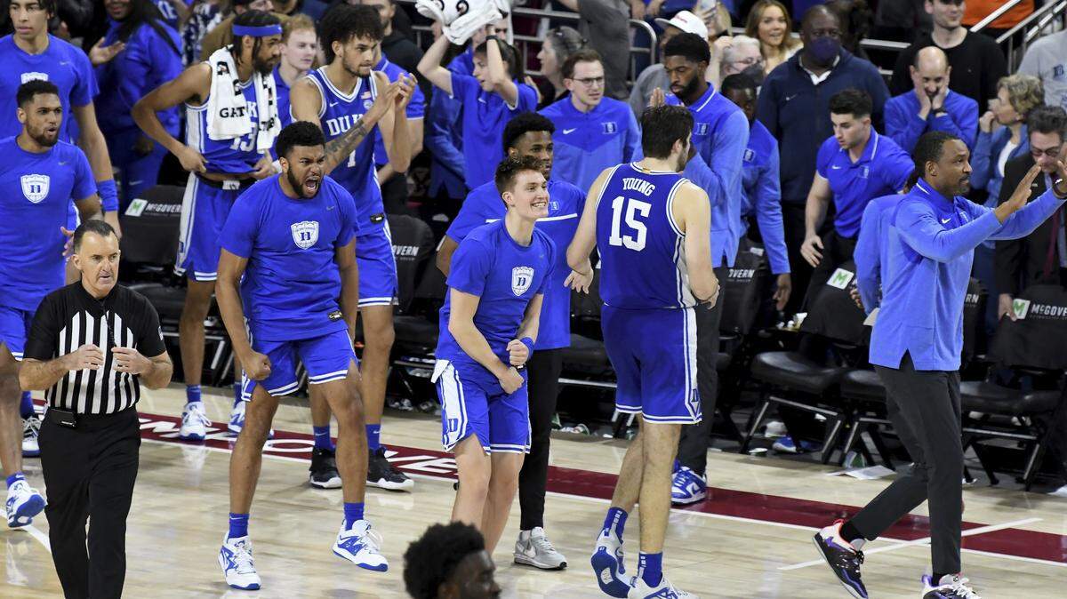 Duke players celebrate their 65-64 victory over Boston College in an NCAA college basketball game, Saturday, Jan. 7, 2023, in Boston. (AP Photo/Mark Stockwell)