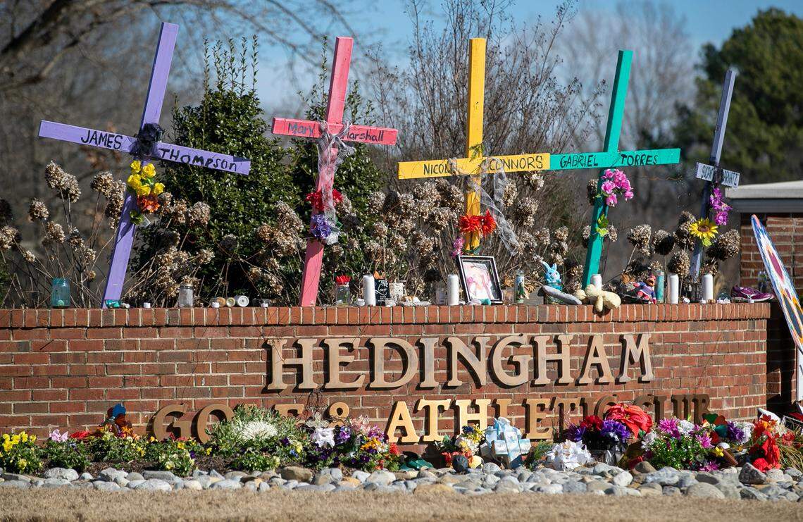 Five crosses memorialize the victims of the mass shooting at the entrance to the Hedingham neighborhood on Friday, January 13, 2023 in Raleigh, N.C. Victims James Thompson, Mary Marshall, Nicole Connors, Raleigh Police Officer Gabriel Torres and Susan Karnatz all lost their lives in the mass shooting on October 13, 2022.