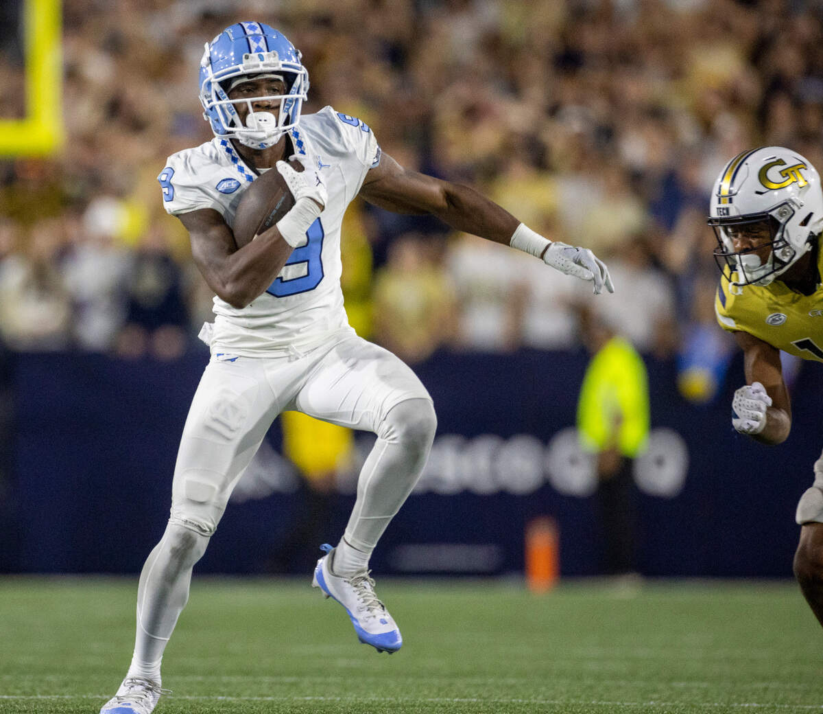North Carolina’s Devontez Walker (9), looks for running room after a 36-yard pass completion from quarterback Drake Maye with 2:54 to play in the game on Saturday, October 28, 2023 at Bobby Dodd Stadium in Atlanta, Georgia.